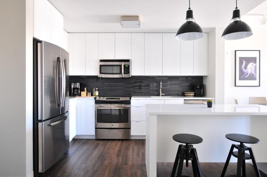 Painted farmhouse kitchen cabinets in warm white
