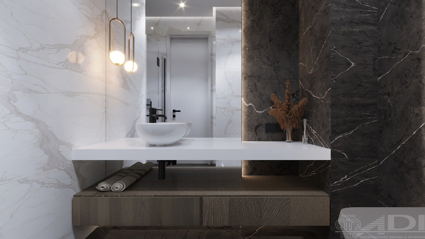 Bathroom with a tiled ledge running along the length of the bath