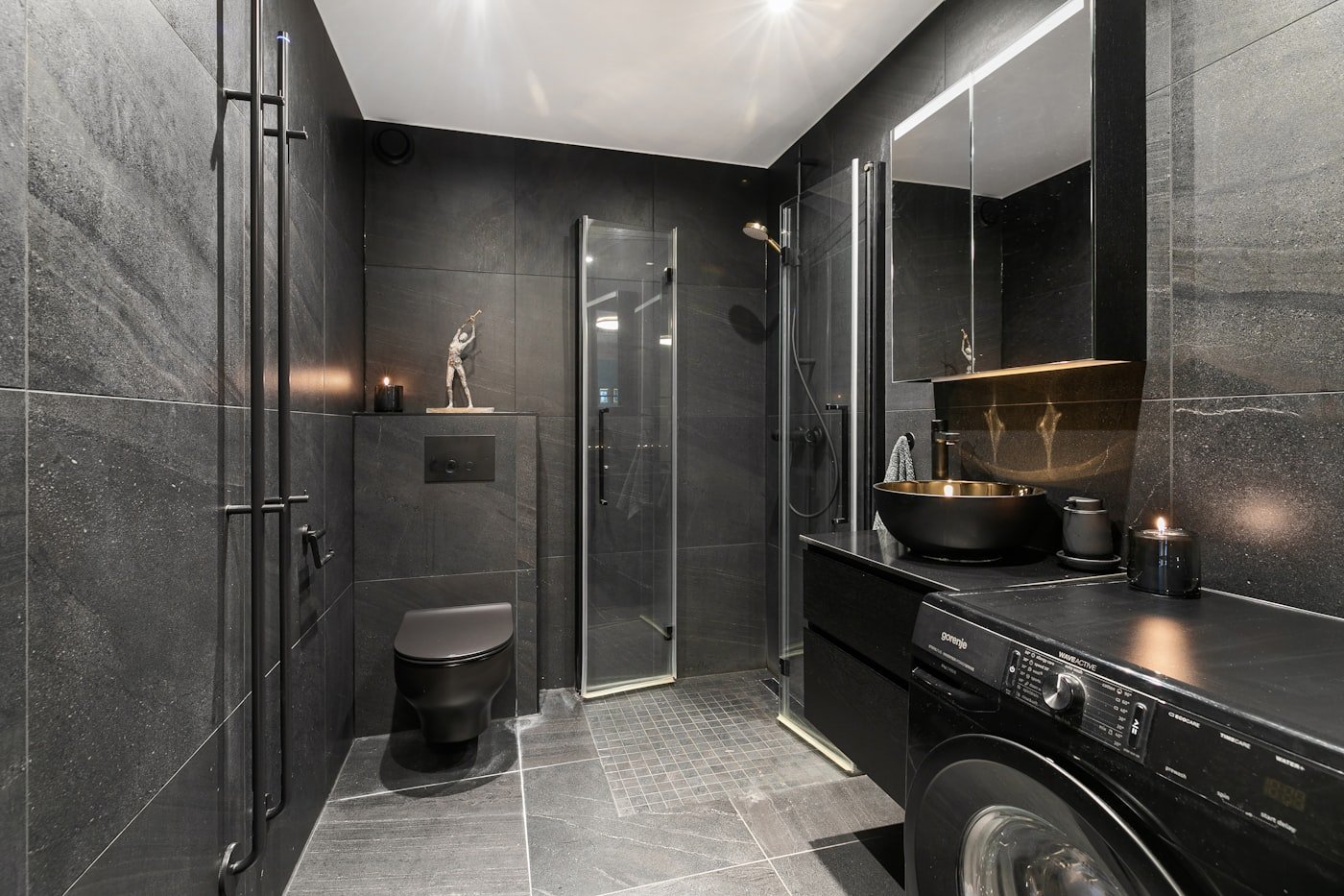 Bathroom with a shelf mounted above the door holding baskets
