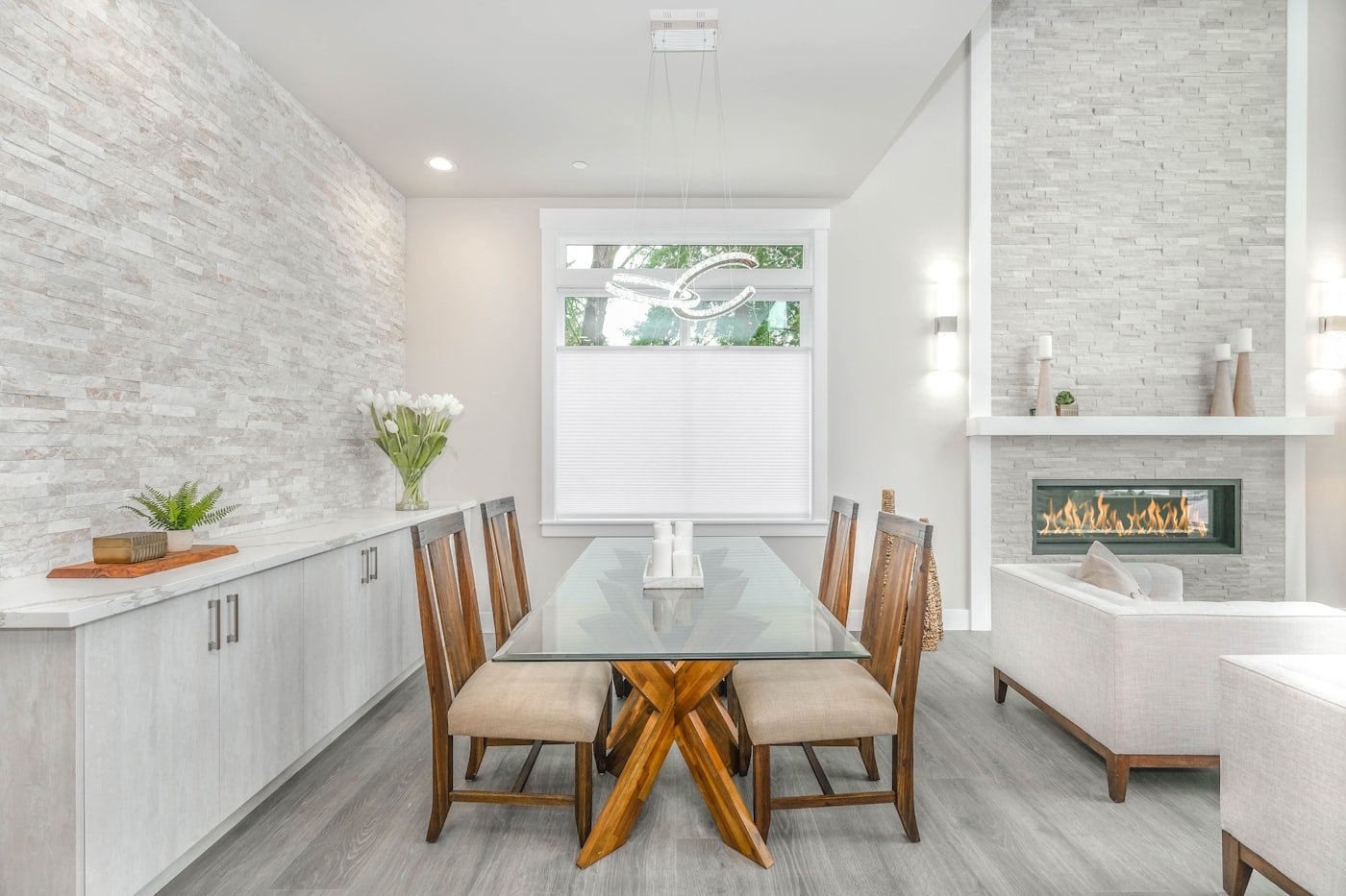 Dining table with a wooden bench along one side and chairs on the other