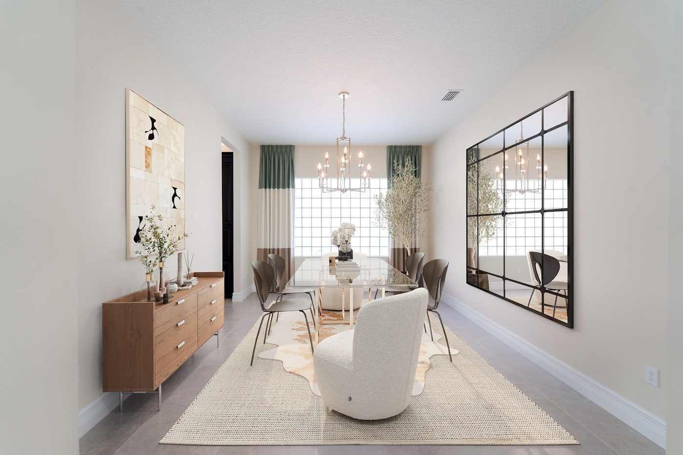 Dining room with upholstered dining chairs in a warm neutral fabric