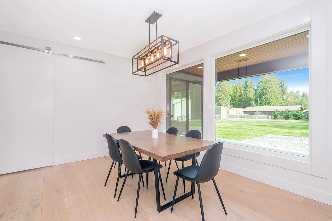Dining room with a long low wooden sideboard against the wall