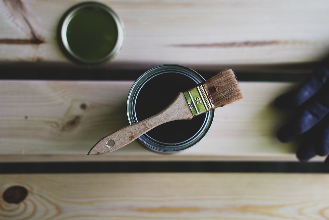 Paint samples on a wall in different neutral shades