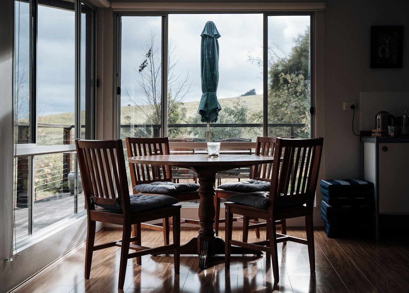 Two black metal dome pendants hanging over a kitchen island