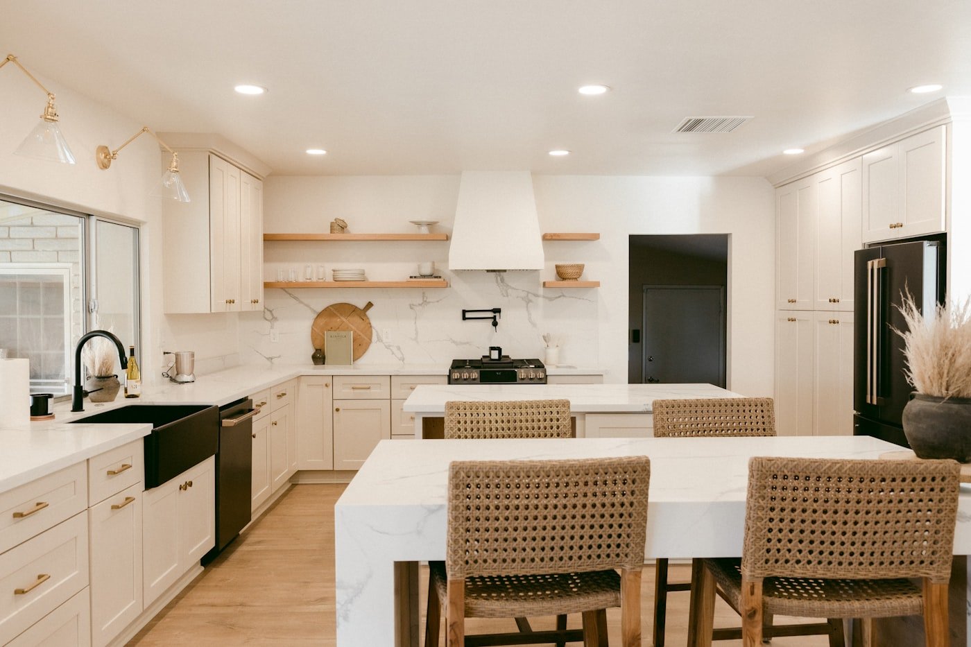 Traditional kitchen with cream painted cabinets and a stone floor
