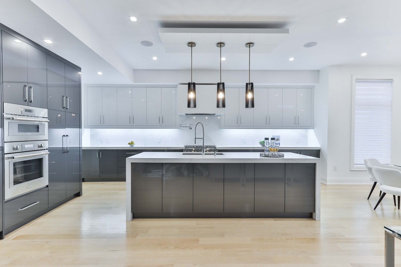Kitchen with sage green lower cabinets and white upper cabinets