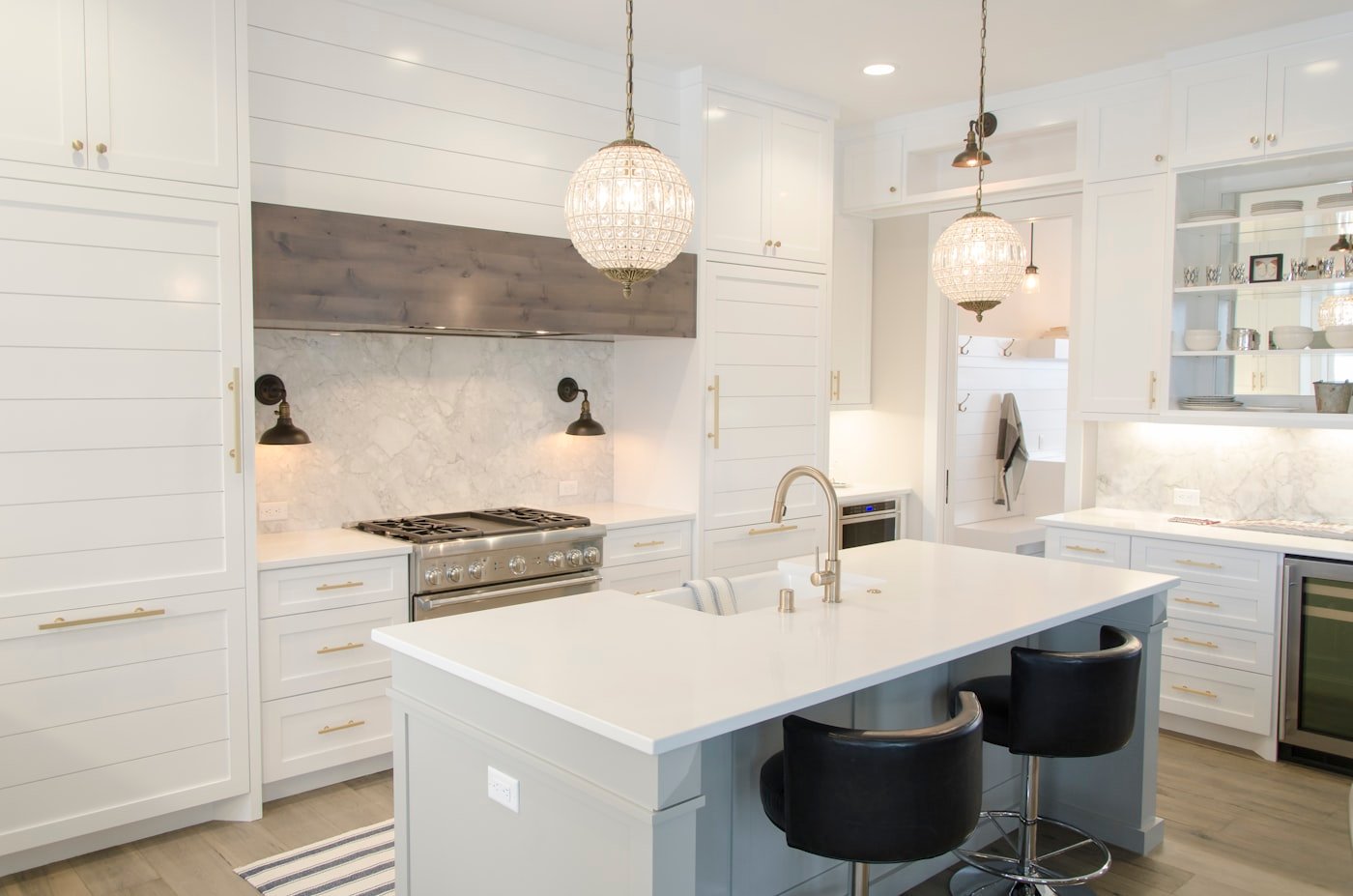 Kitchen with flat-front natural oak cabinets and a stone countertop