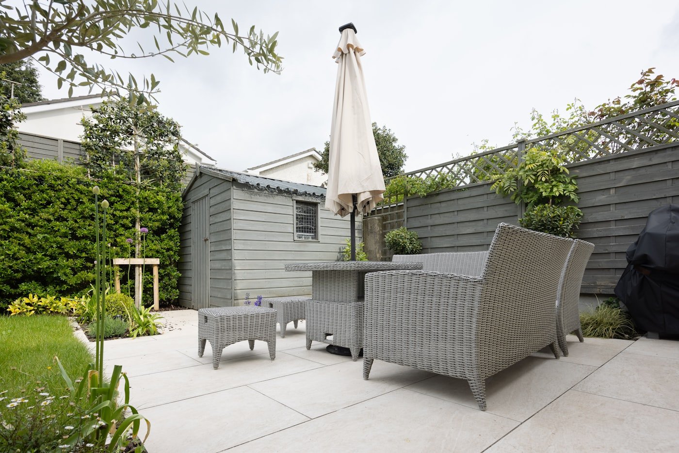 Balcony with a slim bench along the railing topped with cushions