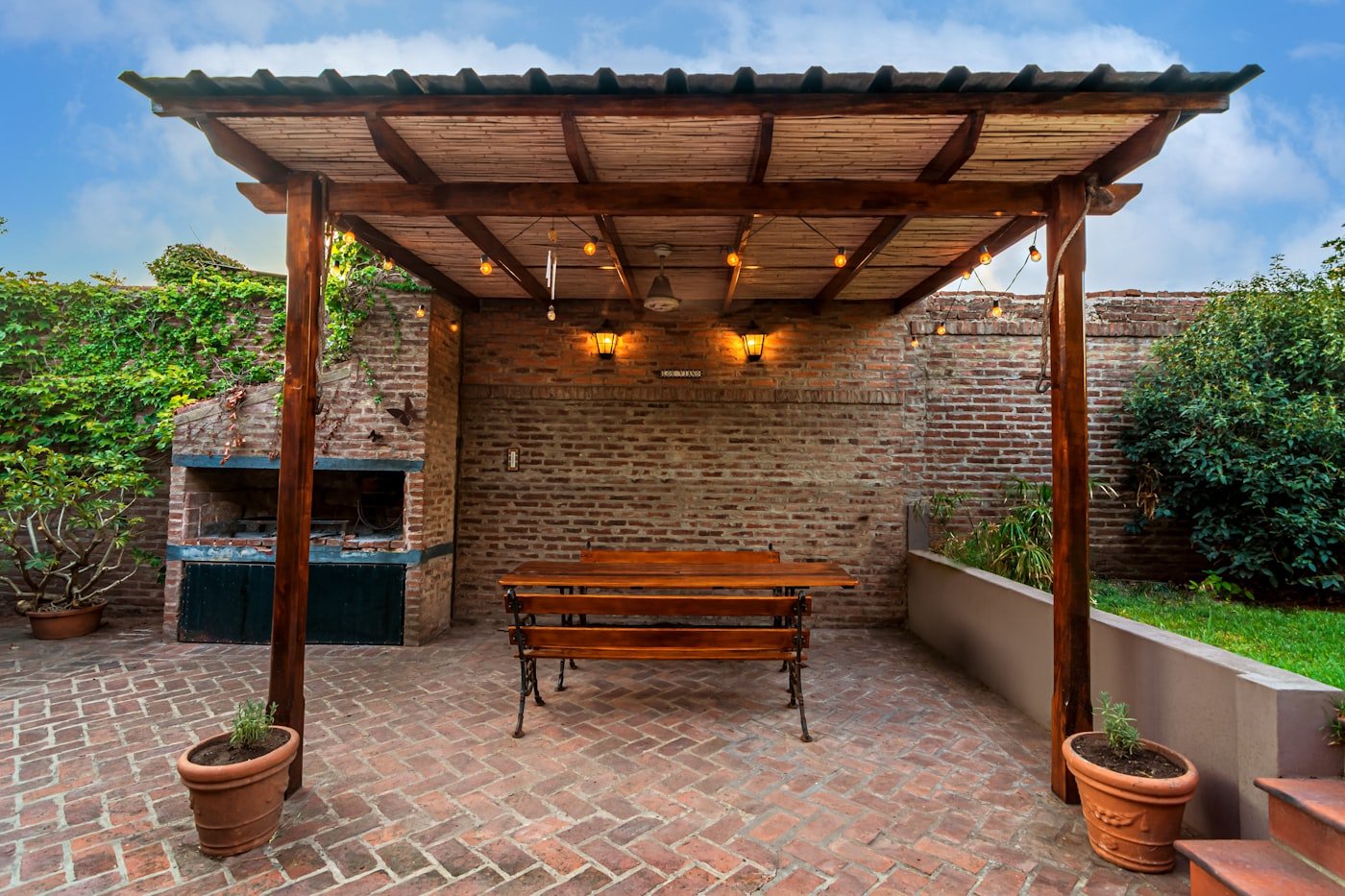 Small patio with a round metal bistro table and two folding chairs