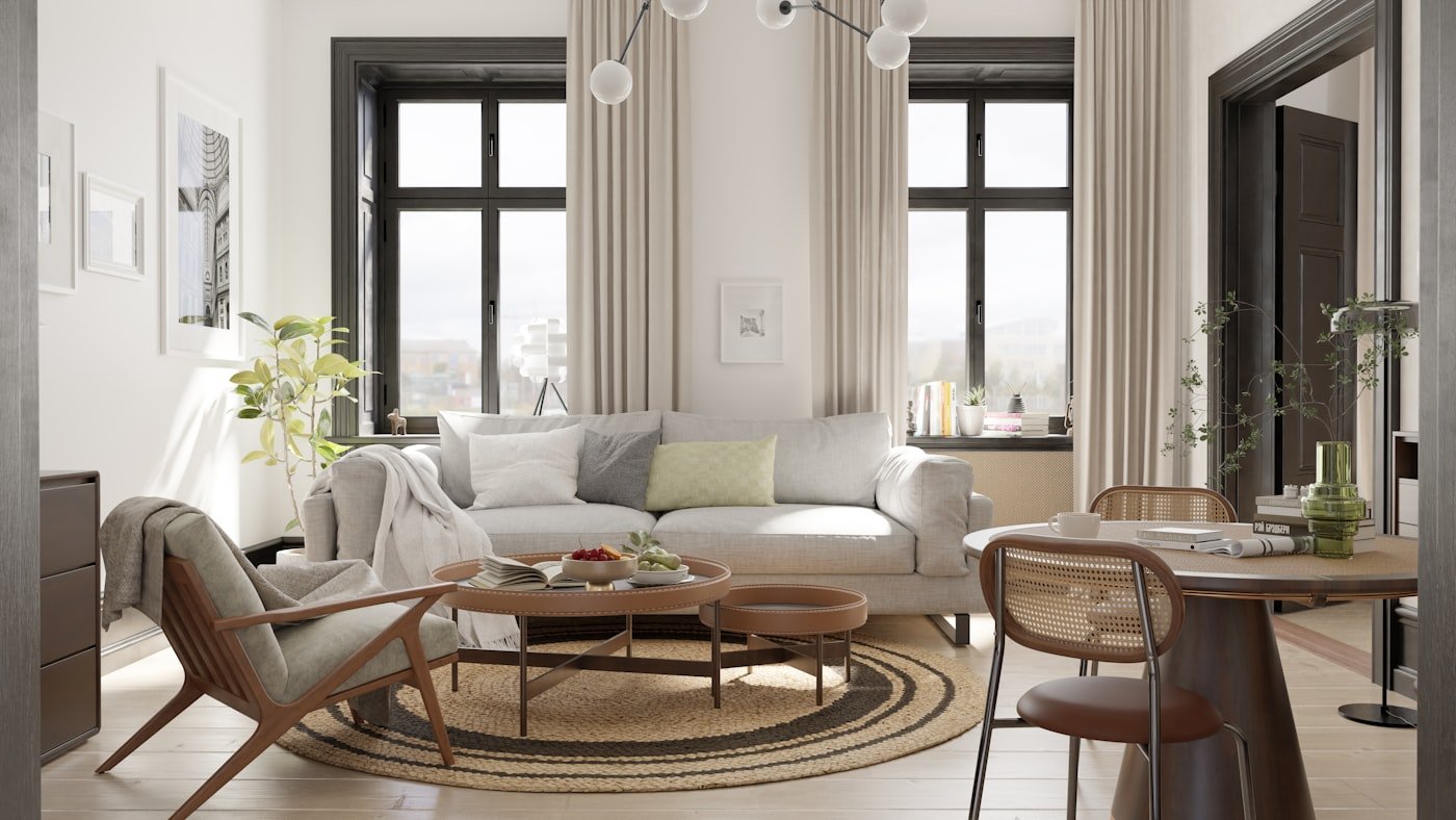 Pale grey wool rug beside a low wooden bed on a light floor